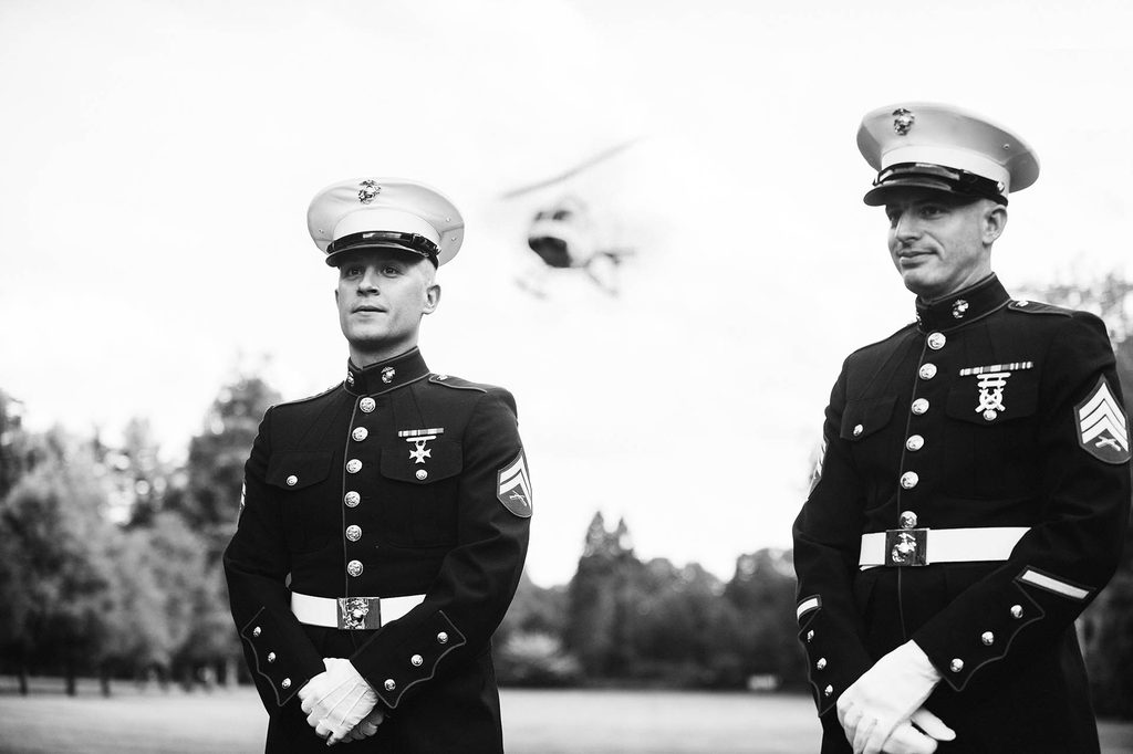 Black and White wedding photo of the groom and his bestman, both U.S. Marines in uniform, after arriving to the ceremony by helicopter at The Wadsworth Mansion