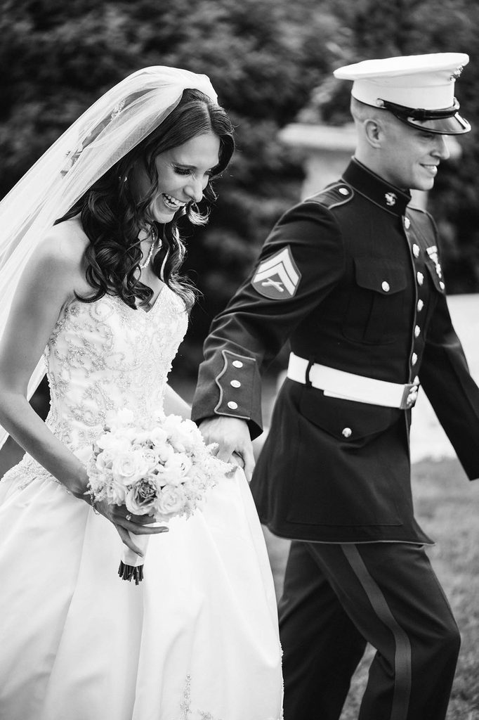 Black and White wedding photo of the bride and groom, a U.S. Marine in uniform, just after being married at The Wadsworth Mansion